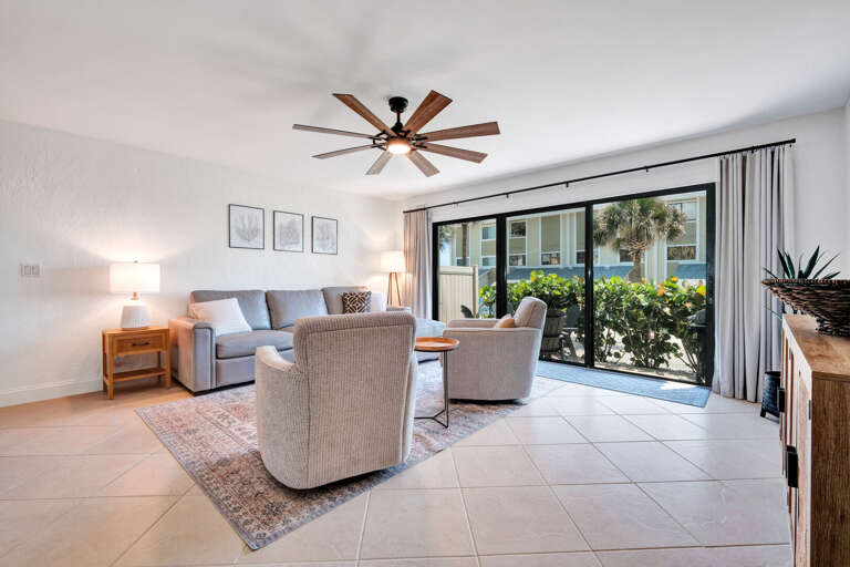 Enjoy morning coffee or evening breezes on the private patio just off the living room, featuring a charming seating area!