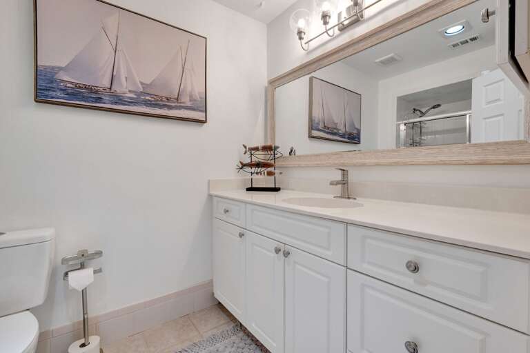 Freshen up in the bright and clean guest bathroom, designed for your guest's convenience.