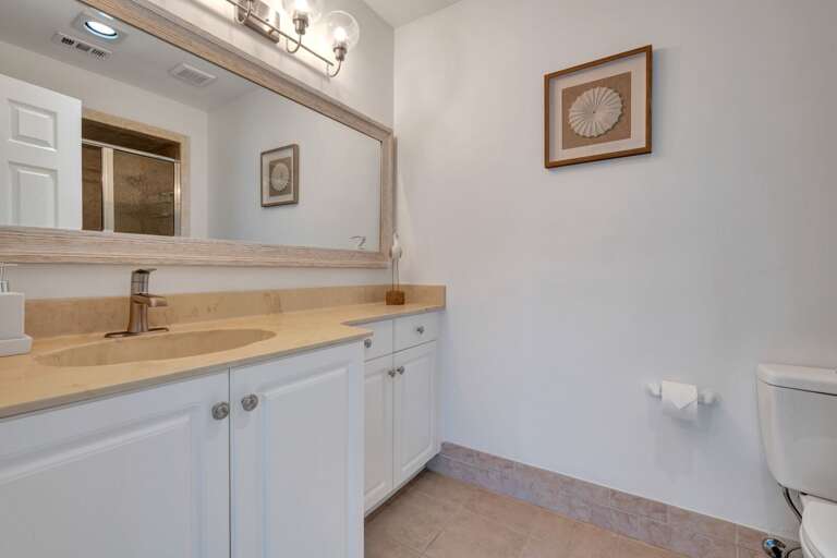 Refresh and recharge in the en suite master bathroom, your private spa-like retreat after a day at the beach!