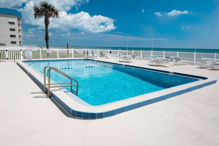 Take a refreshing dip in the oceanfront pool at Oceanside Village - your perfect spot to unwind by the sea! Take a refreshing dip in the oceanfront pool at Oceanside Village - your perfect spot to unwind by the sea!