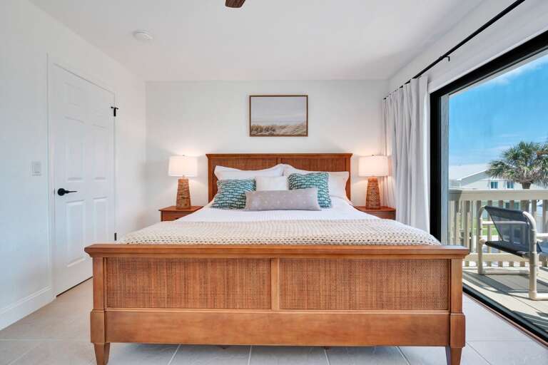 Rest easy in the master bedroom, featuring a plush king bed for ultimate comfort after a day by the ocean.