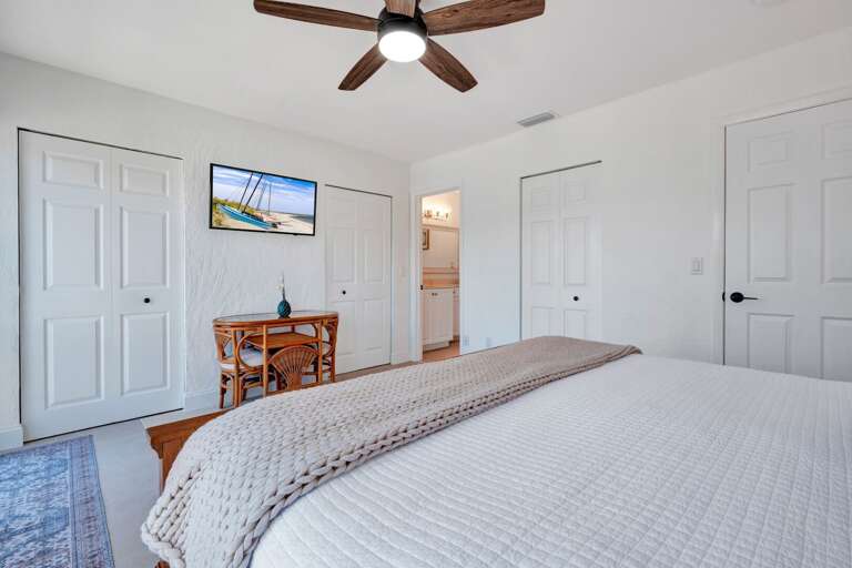 Unwind in the master bedroom with a cozy king bed and your own TV for laid-back evenings.
