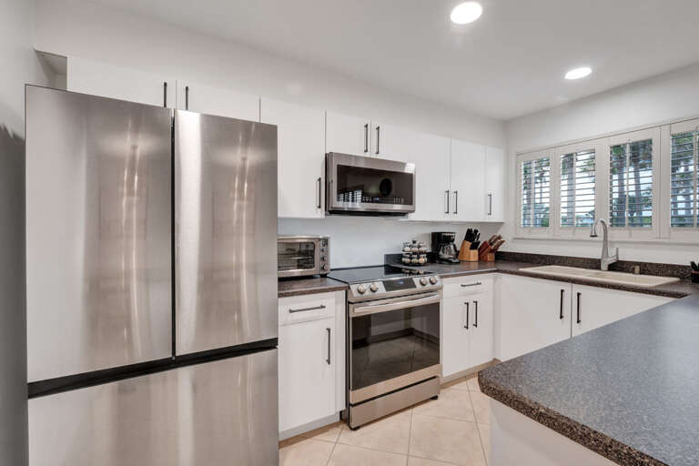 Whip up your favorite dishes in the sleek, fully equipped kitchen with modern stainless steel appliances.