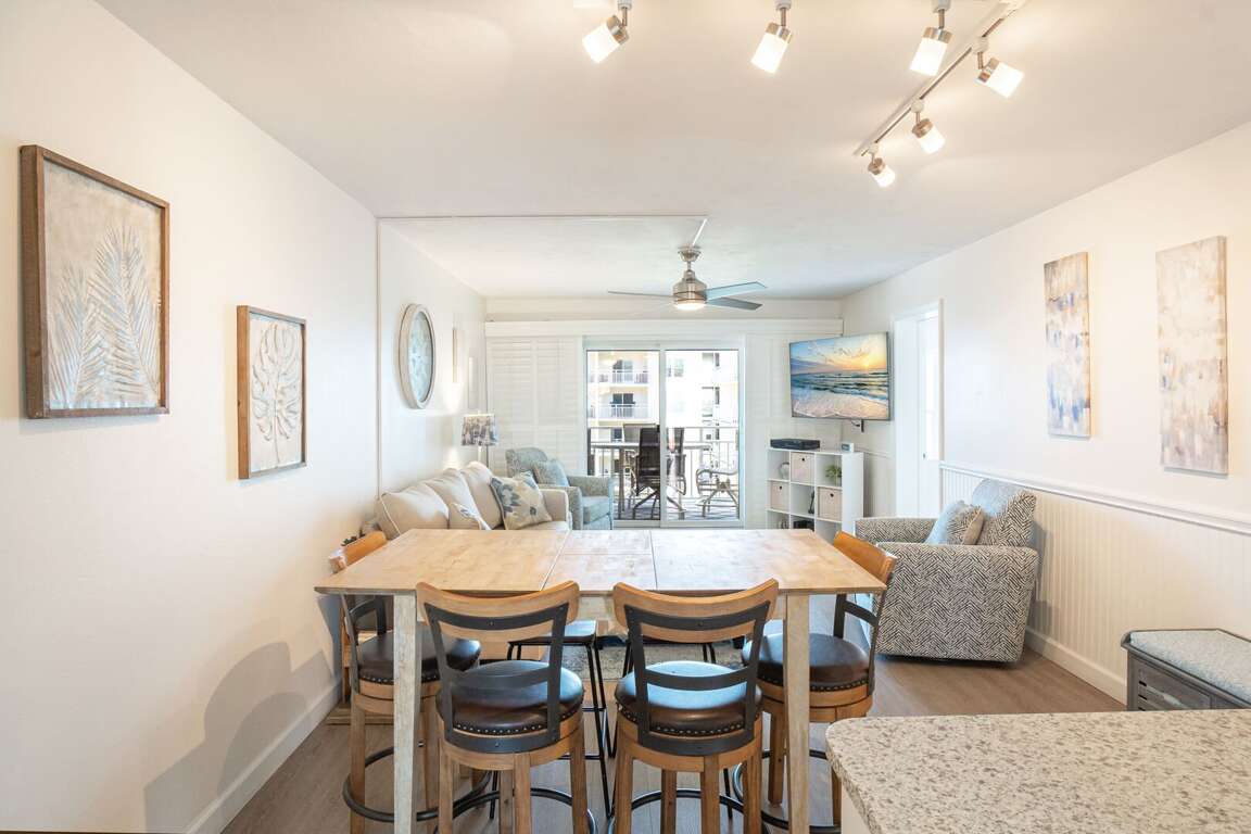 Dining room with seating for six, perfect for enjoying meals together with family and friends Dining room with seating for six, perfect for enjoying meals together with family and friends