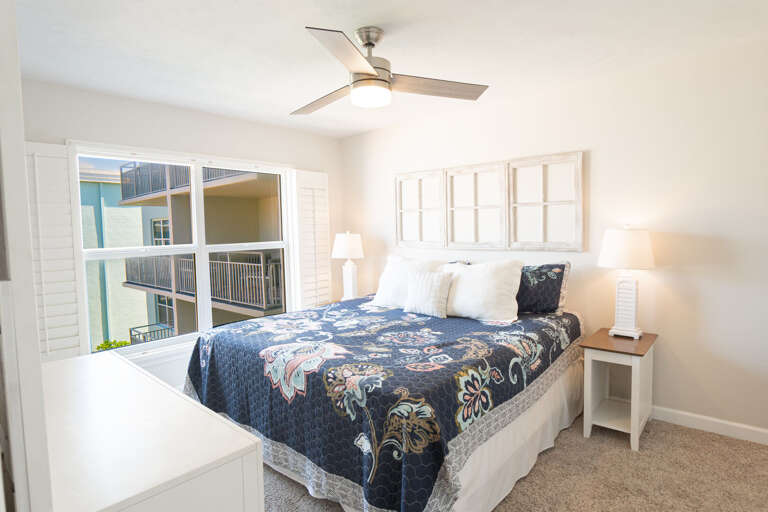 Master bedroom with a luxurious king bed, TV, and views of the ocean and pool for the ultimate relaxation Master bedroom with a luxurious king bed, TV, and views of the ocean and pool for the ultimate relaxation