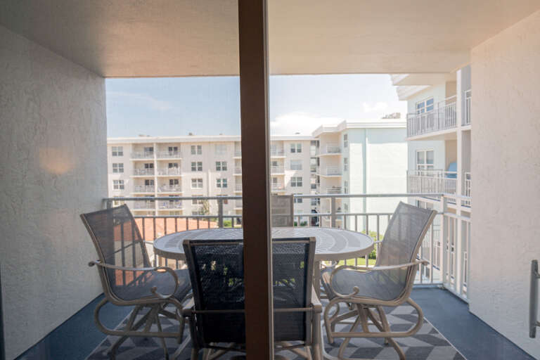 Private 4th-floor balcony with a table and chairs, perfect for enjoying meals or simply relaxing while taking in the views Private 4th-floor balcony with a table and chairs, perfect for enjoying meals or simply relaxing while taking in the views