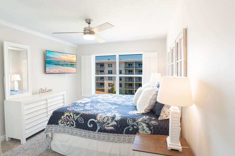 Unwind in the master bedroom, featuring a luxurious king bed with pool and ocean views Unwind in the master bedroom, featuring a luxurious king bed with pool and ocean views