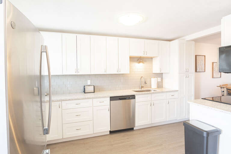 Updated kitchen with ample cabinet space, providing plenty of room for all your kitchen essentials and meal prep needs Updated kitchen with ample cabinet space, providing plenty of room for all your kitchen essentials and meal prep needs