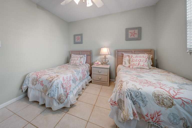 The beachy guest bedroom sleeps two guests in cozy twin beds The beachy guest bedroom sleeps two guests in cozy twin beds