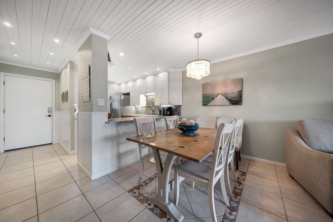 Dine in comfort at the updated dining area with seating for four and a bright, beachside atmosphere Dine in comfort at the updated dining area with seating for four and a bright, beachside atmosphere