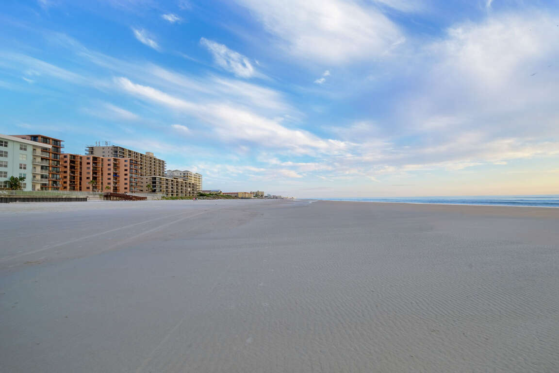 Enjoy a family-friendly getaway on the no-drive section of New Smyrna Beach, where you can relax and play safely in the sand Enjoy a family-friendly getaway on the no-drive section of New Smyrna Beach, where you can relax and play safely in the sand