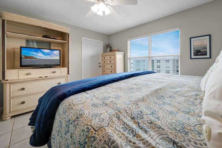 The master bedroom features a king bed, a TV, stunning ocean views, and private access to the balcony The master bedroom features a king bed, a TV, stunning ocean views, and private access to the balcony
