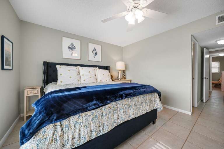 Rest easy in the master bedroom, complete with a spacious king bed, perfect for a relaxing night's sleep with ocean views Rest easy in the master bedroom, complete with a spacious king bed, perfect for a relaxing night's sleep with ocean views