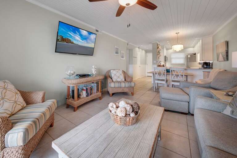 The spacious living room is the perfect spot to unwind after a fun day at New Smyrna Beach or enjoy a cozy family movie night The spacious living room is the perfect spot to unwind after a fun day at New Smyrna Beach or enjoy a cozy family movie night
