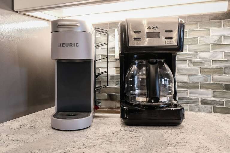 Start your day right with a choice of a standard drip or Keurig coffee maker in the kitchen, ensuring the perfect cup every time Start your day right with a choice of a standard drip or Keurig coffee maker in the kitchen, ensuring the perfect cup every time
