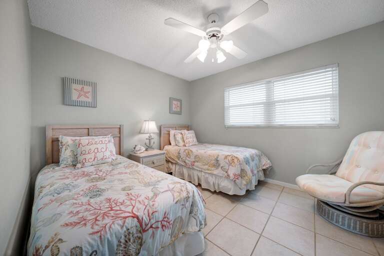 With two twin beds, the guest bedroom provides a comfortable option for additional guests or children in your beachside escape With two twin beds, the guest bedroom provides a comfortable option for additional guests or children in your beachside escape