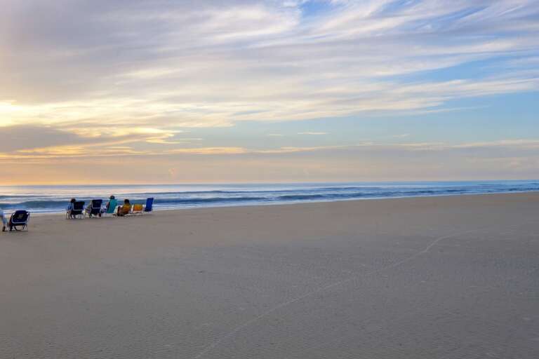 With its wide, flat beach, New Smyrna Beach offers the ideal setting for a variety of beach activities, from building sandcastles to kite flying With its wide, flat beach, New Smyrna Beach offers the ideal setting for a variety of beach activities, from building sandcastles to kite flying