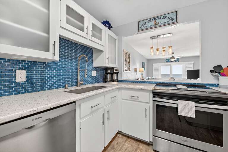 Cook up a storm in the fully equipped kitchen with stainless steel appliances and a beautiful beach view.