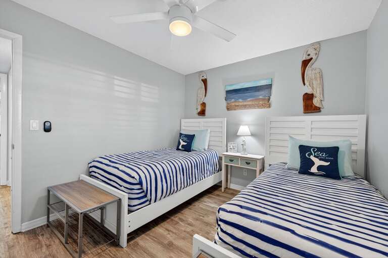 Cozy guest bedroom with two twin beds.