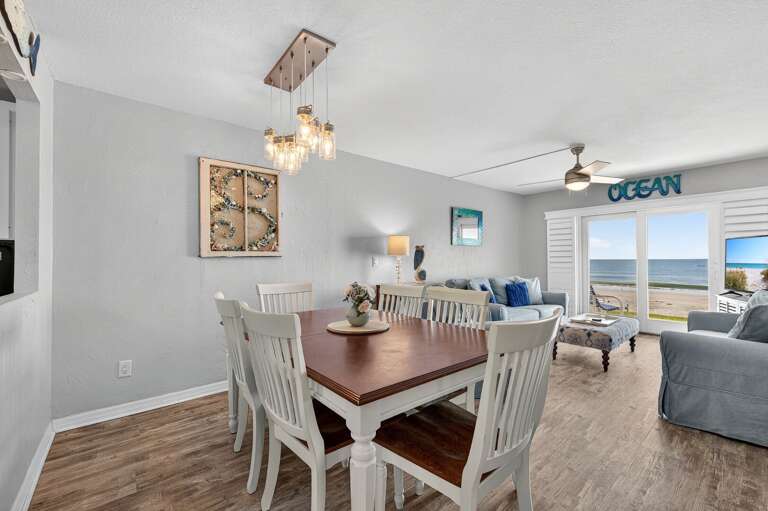 Enjoy meals with a view at the 6-seater dining table overlooking the sparkling ocean.