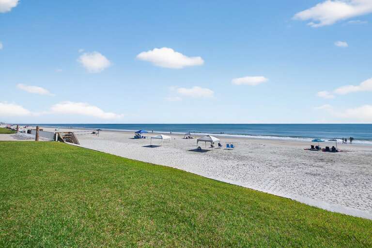 Step directly from Sea Coast Gardens III 104 onto the pristine sands of New Smyrna's beautiful no-drive beach.