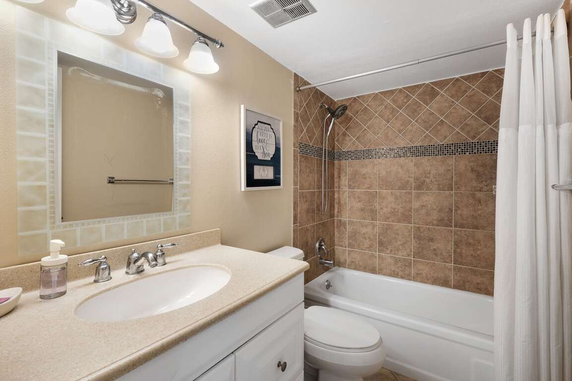 The guest bathroom conveniently features a tub/shower combo, providing flexibility for your guests during their stay The guest bathroom conveniently features a tub/shower combo, providing flexibility for your guests during their stay