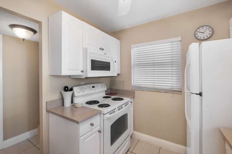 Whip up your favorite meals in this fully equipped kitchen, featuring everything you need for a seamless cooking experience during your beach getaway Whip up your favorite meals in this fully equipped kitchen, featuring everything you need for a seamless cooking experience during your beach getaway