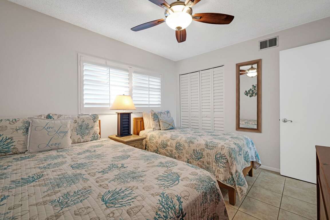 The comfortable guest bedroom sleeps 3, featuring a queen bed and a twin bed for a restful stay. The comfortable guest bedroom sleeps 3, featuring a queen bed and a twin bed for a restful stay.
