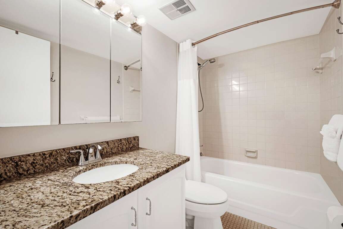 The guest bathroom is equipped with a tub/shower combo The guest bathroom is equipped with a tub/shower combo