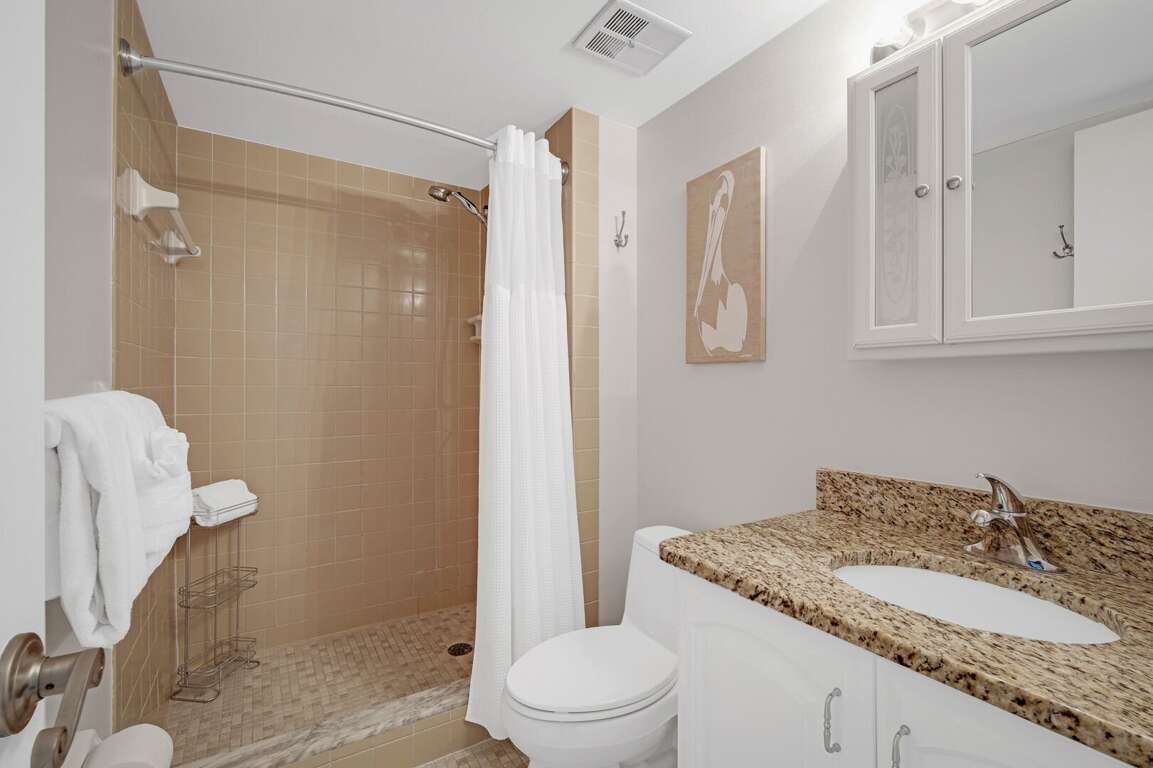 The master bathroom features a tile shower and plush spa towels The master bathroom features a tile shower and plush spa towels