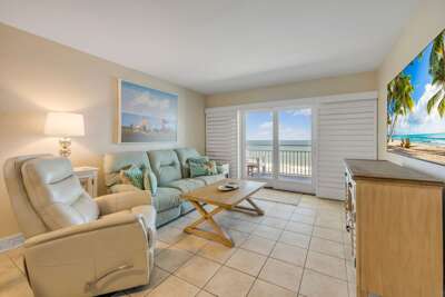 Welcome to Sea Coast Gardens III 402, your direct oceanfront escape on the serene no-drive section of New Smyrna Beach