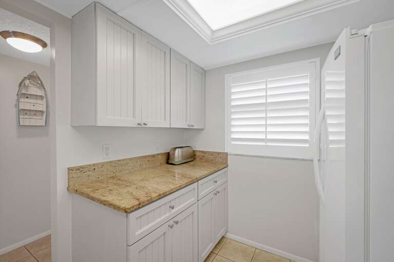 The updated kitchen is complete with granite countertops The updated kitchen is complete with granite countertops