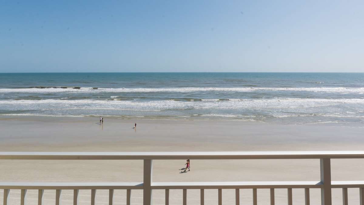 The wide, flat stretch of New Smyrna Beach offers plenty of space for relaxation, water sports, and family fun The wide, flat stretch of New Smyrna Beach offers plenty of space for relaxation, water sports, and family fun
