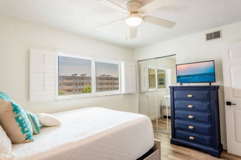 The guest bedroom also has a queen bed with a window overlooking the pool. The guest bedroom also has a queen bed with a window overlooking the pool.