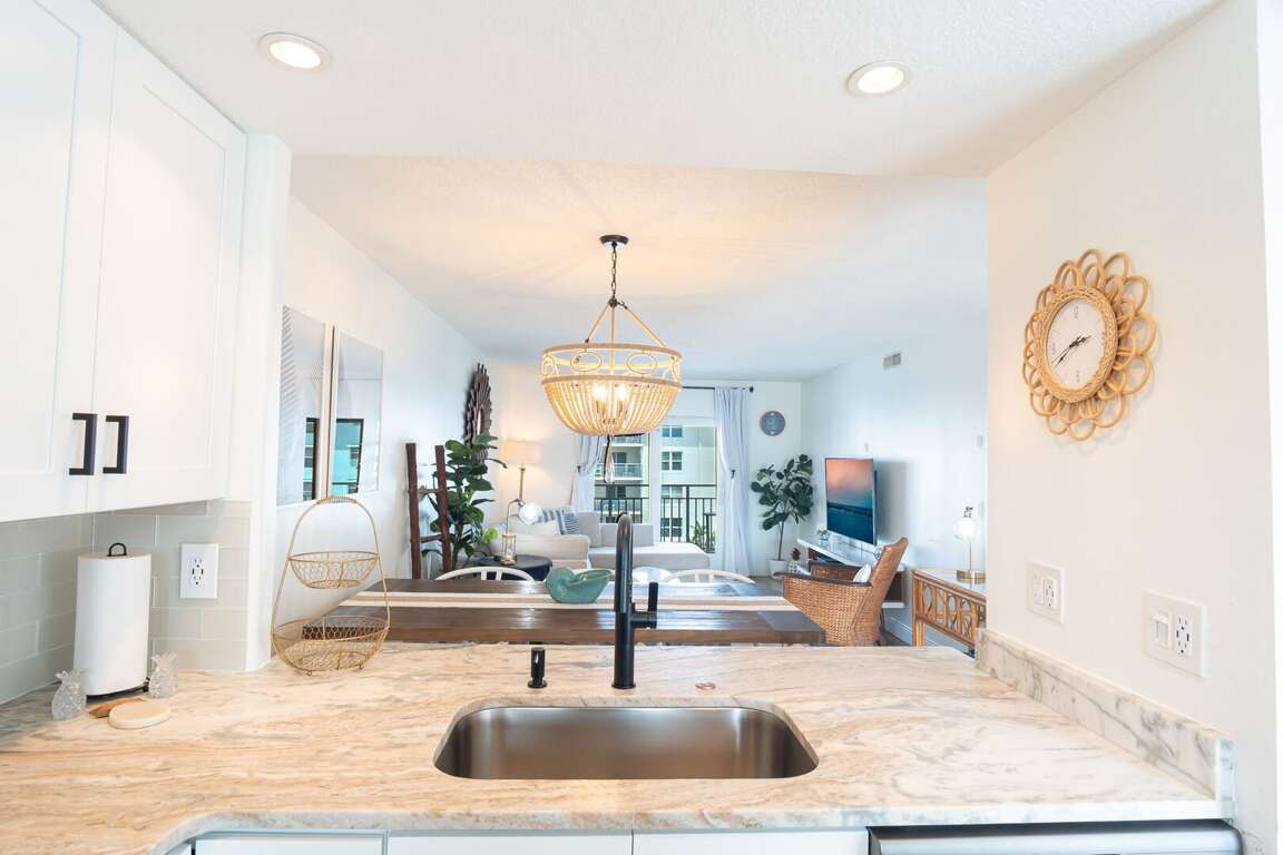 The kitchen sink view overlooking the dining and living areas. The kitchen sink view overlooking the dining and living areas.