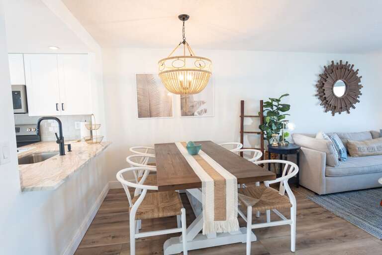 Take a seat with your whole party at this dining room table. Take a seat with your whole party at this dining room table.