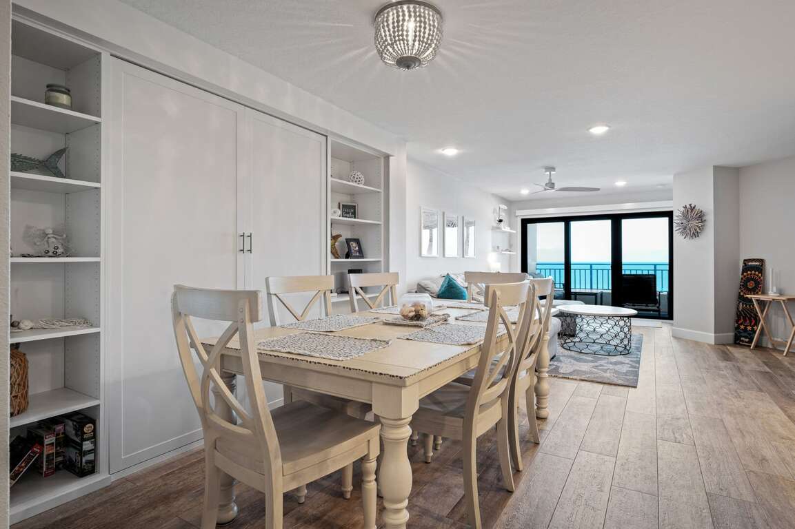 The dining room seats six guests and offers a picturesque view of New Smyrna Beach The dining room seats six guests and offers a picturesque view of New Smyrna Beach