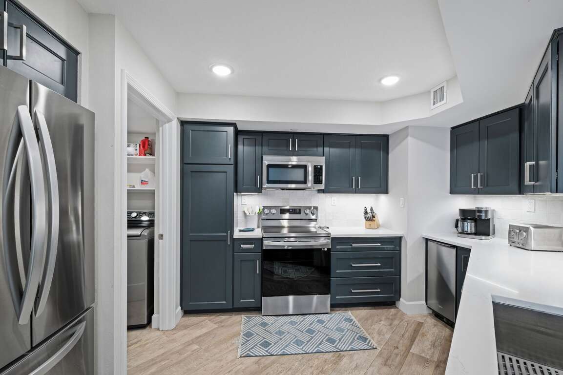 Enjoy cooking in the updated kitchen, featuring sleek stainless steel appliances Enjoy cooking in the updated kitchen, featuring sleek stainless steel appliances
