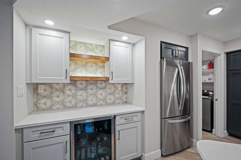 The fully equipped kitchen features sleek stainless steel appliances The fully equipped kitchen features sleek stainless steel appliances