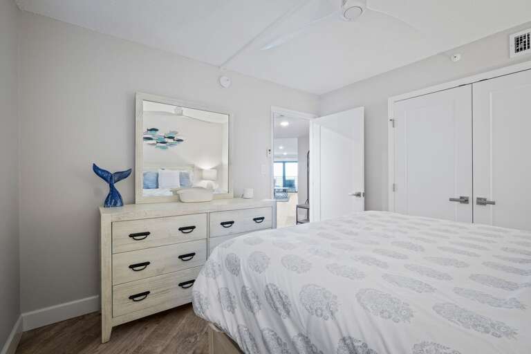 The guest bedroom offers a cozy queen bed for a restful stay The guest bedroom offers a cozy queen bed for a restful stay