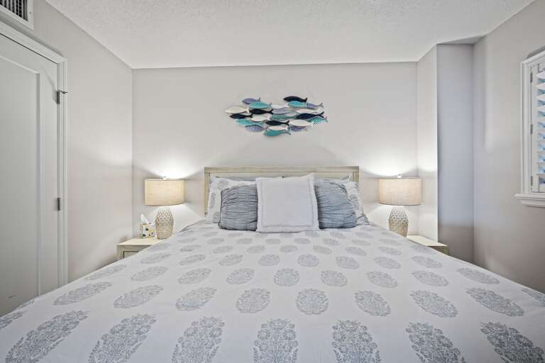 The guest bedroom offers a cozy queen bed for a restful stay The guest bedroom offers a cozy queen bed for a restful stay