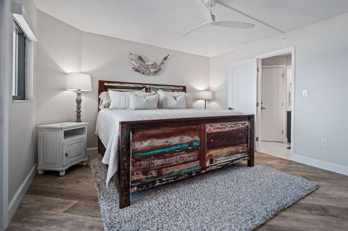 The master bedroom boasts a comfortable king bed for a restful night's sleep The master bedroom boasts a comfortable king bed for a restful night's sleep