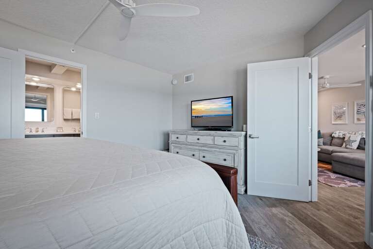 The master bedroom features a king bed, a TV, and an ensuite bathroom The master bedroom features a king bed, a TV, and an ensuite bathroom