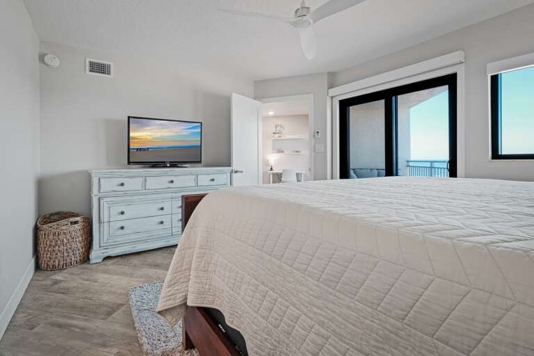 The master bedroom features a king bed, a TV, private balcony access, and a stunning ocean view The master bedroom features a king bed, a TV, private balcony access, and a stunning ocean view