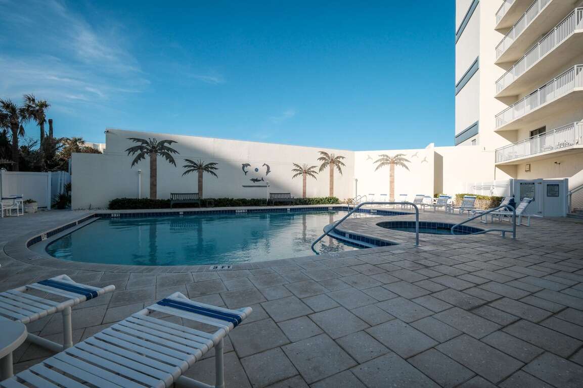 The Seascape Towers pool deck features a seasonally heated pool, a relaxing hot tub, and plenty of chairs and tables for your enjoyment The Seascape Towers pool deck features a seasonally heated pool, a relaxing hot tub, and plenty of chairs and tables for your enjoyment