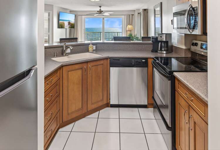 Cook with a view in the updated kitchen featuring stainless steel appliances