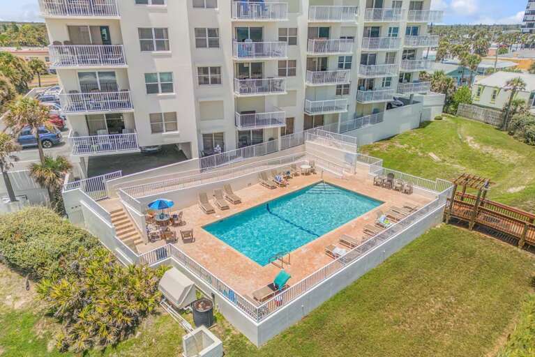 Dive into relaxation at Seawinds' beachfront, seasonally heated pool just steps from the sand