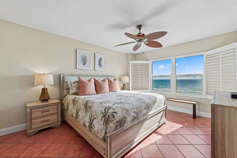 Wake up to endless ocean views in the direct oceanfront master bedroom featuring a king bed, ensuite bath, and TV Wake up to endless ocean views in the direct oceanfront master bedroom featuring a king bed, ensuite bath, and TV