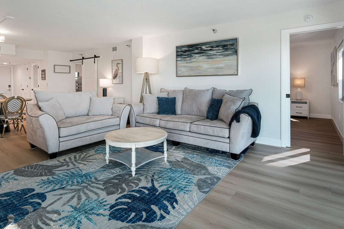 The living room has two comfortable couches - the perfect place to relax after a beach day The living room has two comfortable couches - the perfect place to relax after a beach day