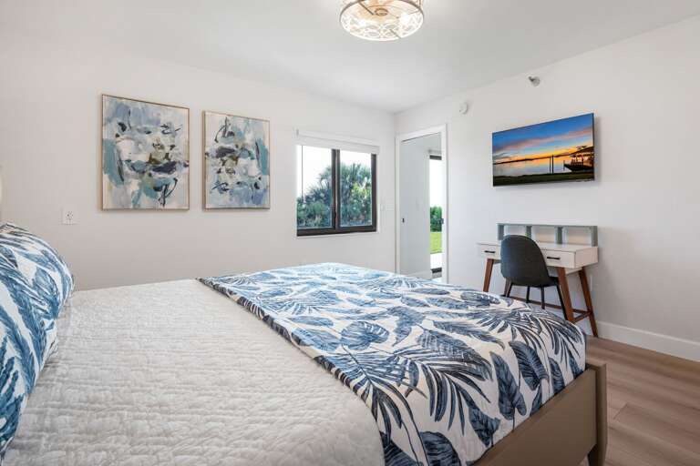 The master bedroom has a mounted TV and an ocean view The master bedroom has a mounted TV and an ocean view